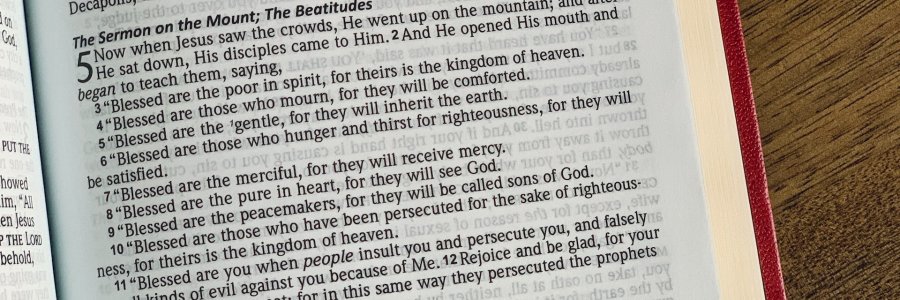 An NASB Bible open to the Beatitudes in the Gospel of Matthew.